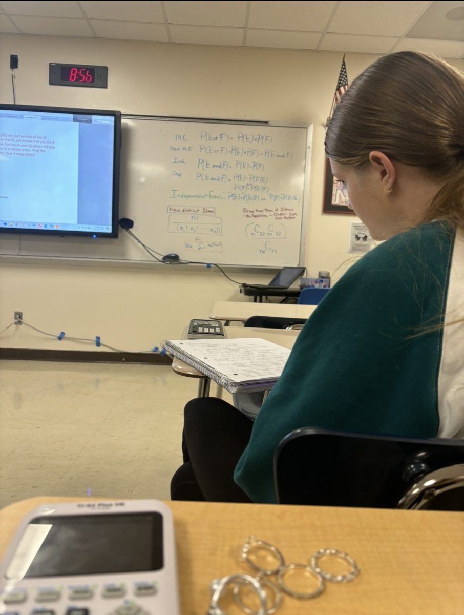 Natalie Nichols reviews notes in Statistics class. This class requires a lot of memorization of formulas
so taking pictures or writing them down is very beneficial!
