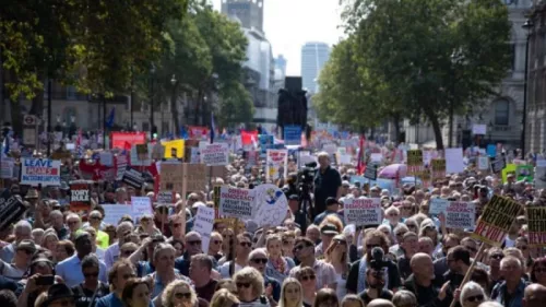 Protesters rally, showing the impact of freedom of speech and accountability in today's society. 
