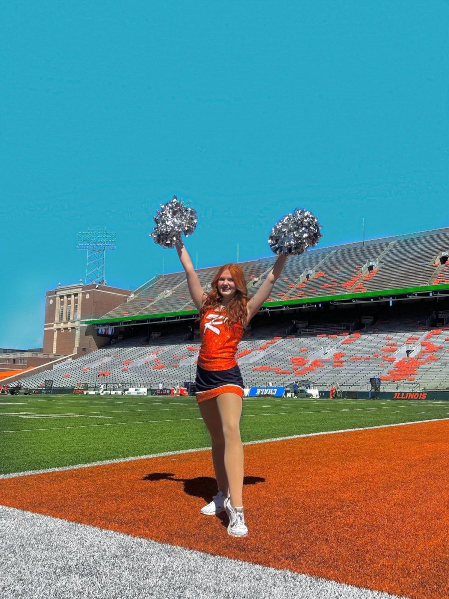 Jillian Covert on the field at the University of Illinois before performing 