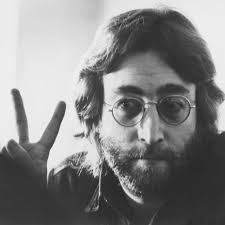 A photo of John Lennon holding up a peace sign, this was promotion for his new song ‘Give Peace a Chance.’